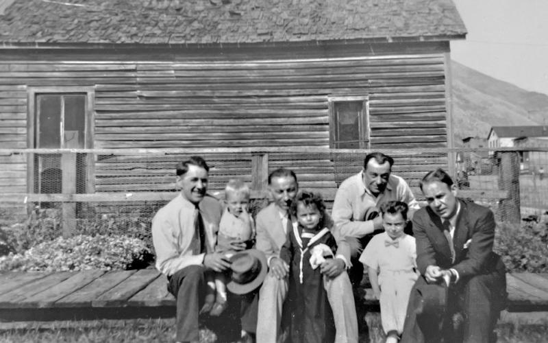 A very young Zeke (far left-hand side) being held by his father. Photo credit the Zanoni Family
