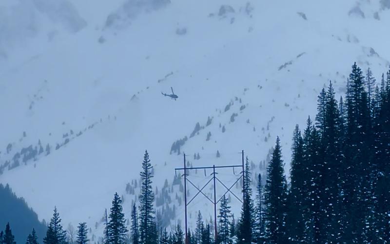 Helicopter heading into the Middle Fork of Mineral Creek to recover avalanche victim. Photo credit DeAnne Gallegos