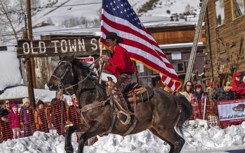 The flag and rider at the start of the Skijoring weekend. Photo Credit Wesley Berg