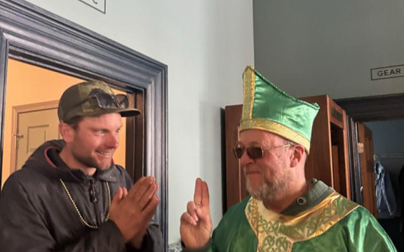 Jackson Perry gets a blessing from the St. Patrick’s Day Pope aka Dr. Brown photo by Sarah Moore