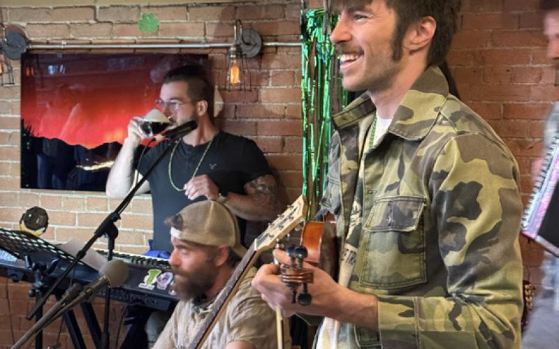 Local musicians Jeff, Jerome &amp; Julian play at the St Patrick's Day party at The Den photo by DeAnne Gallegos