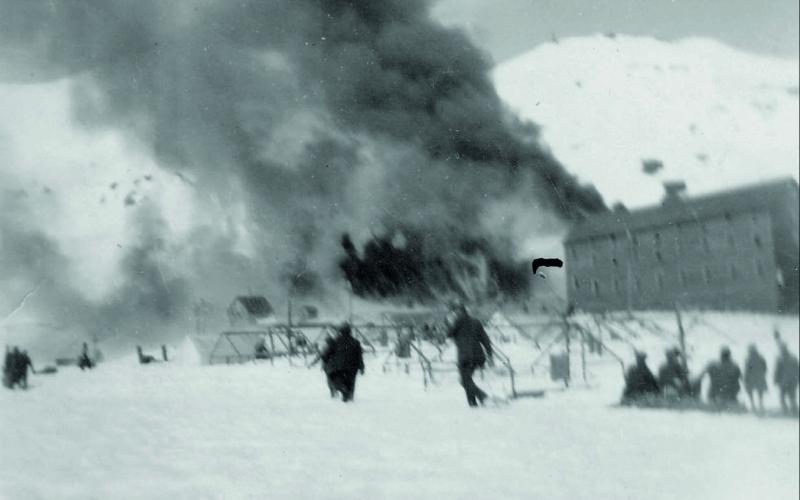 FIRE AT THE SUNNYSIDE. Fire engulfs buildings at the Sunnyside Mine on April 19, 1919. The boarding house is on the right. San Juan County Historical Society photos