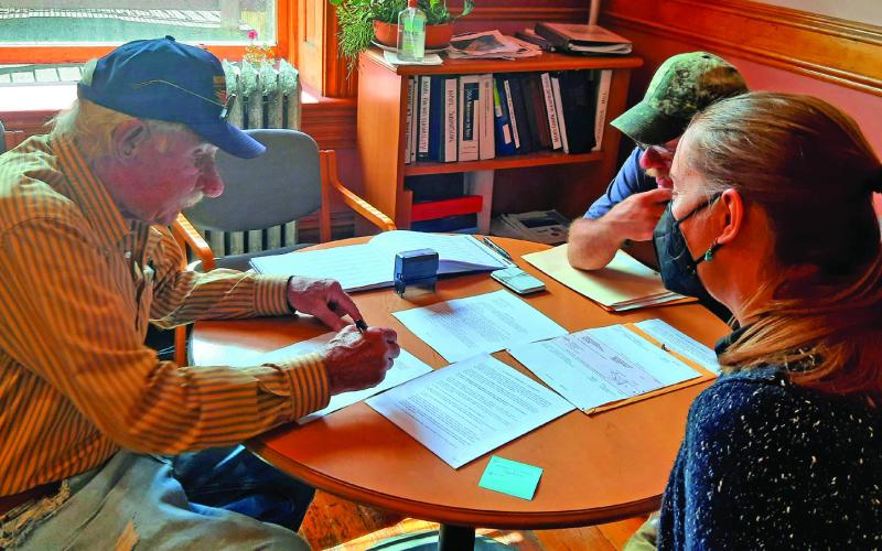 Dave Zanoni, George Zanoni and Town Administrator Gloria Kaasch-Buerger facilitating the closing on the land. Photo Credit Town of Silverton