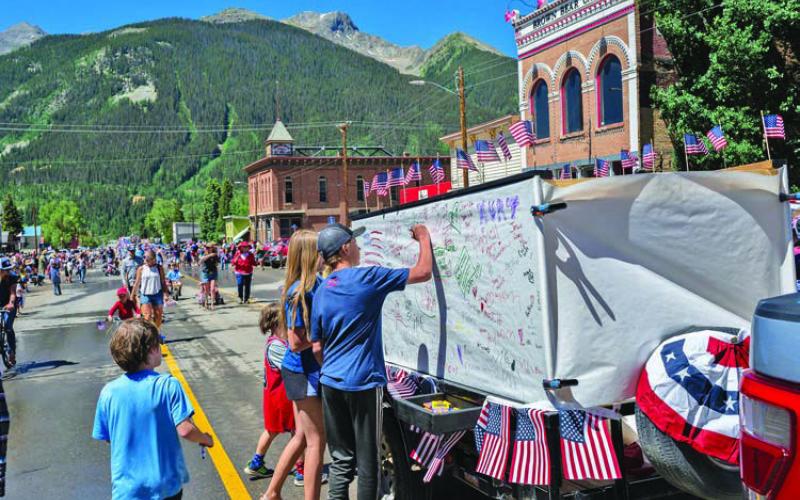 Parade goers got to write on a float. Photo credit Wesley Berg
