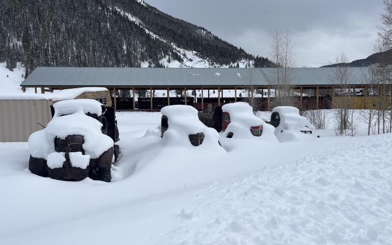 Photo credit Scott Fetchenhier Snow on the antique trucks near the train depot.