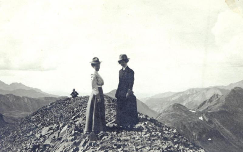 Anna Oberlander, left, with Fredreka Oberlander and Carl Oberlander in the background, on the summit of 13,451-foot-tall Hanson Peak on July 3, 1910.