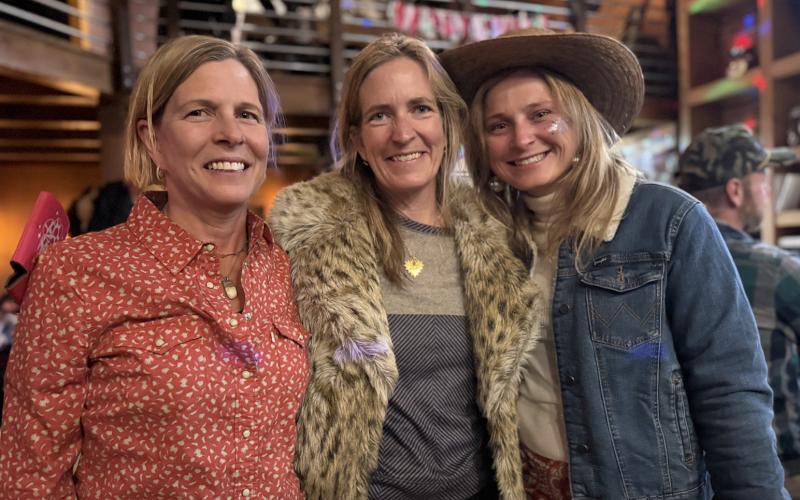 Melissa Childs, Anne Izard, and Aly Wiemken had a great time at the Skijor Rodeo party at The Den Friday Night photo by DeAnne Gallegos