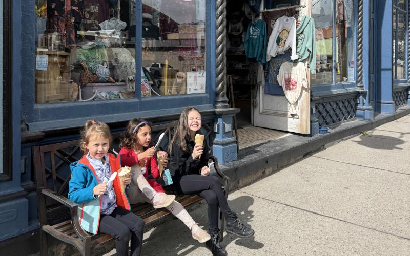 Katey’s daughter Ava and her friends Everly and Olivia enjoy big ice cream cones outside Ava’s mom's shop Skyflower, in downtown Silverton. Photo by Katey Fetchenhier