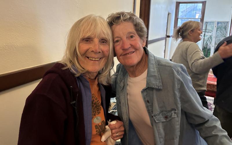 Photo by Becky Joyce Paulette Schmaltz and Jackie Kerwin spend some time catching up during the celebration that was more like a reunion of long-time locals.