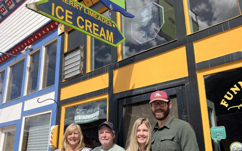 Former owners Tom and Lisa Davis with new owners Lauren Swoboda and Adam Galt. Photo credit DeAnne Gallegos