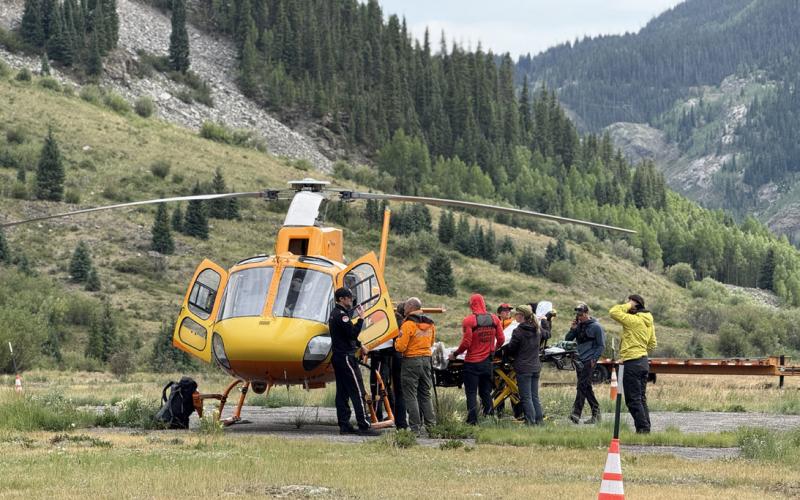 SMR team helps load patient onto Mercy’s Flight for Life Helicopter for transport Photo by DeAnne Gallegos
