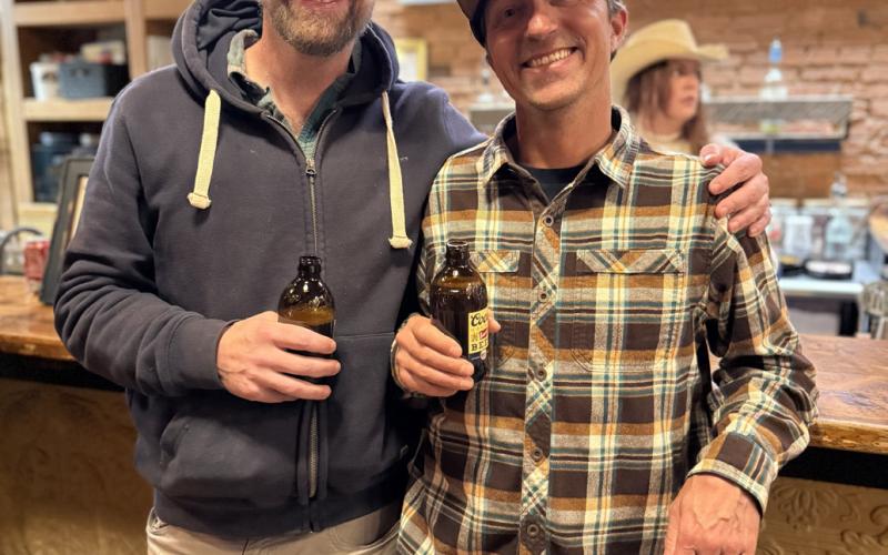 Nick Fattor and Billy Grimes out on the town during the April slow season, sharing a beer together photo by DeAnne Gallegos