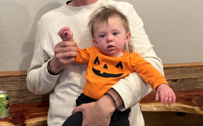 Zachary Dodge and his baby girl enjoyed the festivities at the Dera Deli. Photo by DeAnne Gallegos
