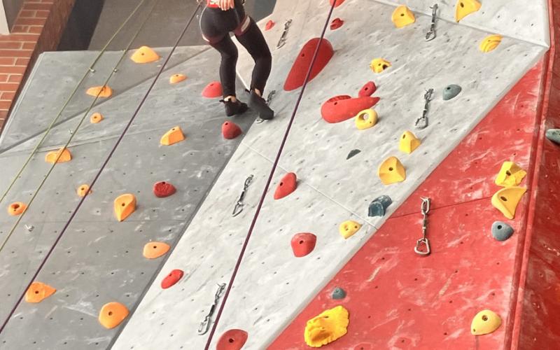 Betsy Barney repelling down at the climbing competition photo by Monica Watton