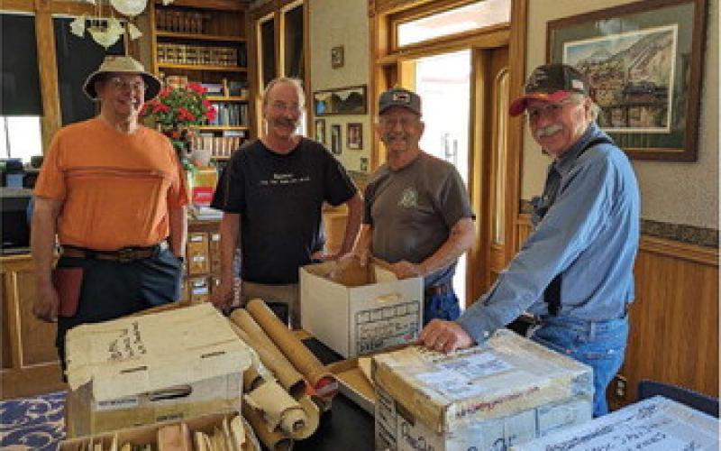 It keeps on coming! Above, ( left to tight) Tom Westervelt, Scott Fetchenhier, Dave Hembree and Bill Jones are unpacking boxesa of Sunnyside material from as far back as 1918. Hembree has donated some of the material and loaned the rest for scanning into the archive records, a process that will keep the volunteer staff busy well into the winter.