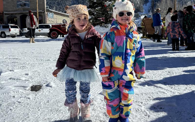 Ava Andrade (l) and Willow Blankenship (r) waiting in line to see Santa. Photo credit Katey Fetch