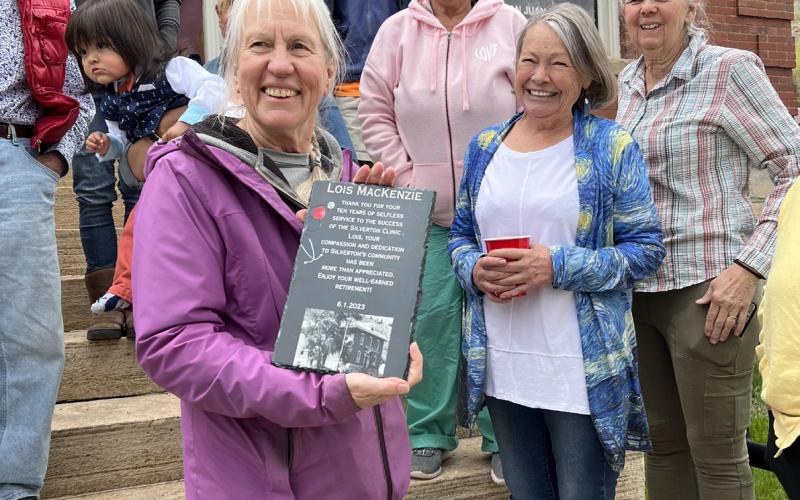 Lois being thanked for her many years of helping our community. Photo by DeAnne Gallegos