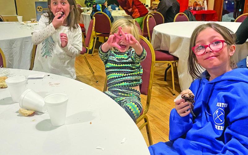 Ella and Val Anderson, with Alida Mead enjoying the potluck at Kendall Night Ski. Photo by Misti Anderson