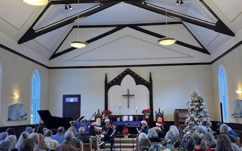 RIGHT Photo credit DeAnne Gallegos Silverton local string musicians Anvil Quartet played to a packed house Sunday afternoon for the Strings &amp; Silver Bells concert at the First Congressional Church
