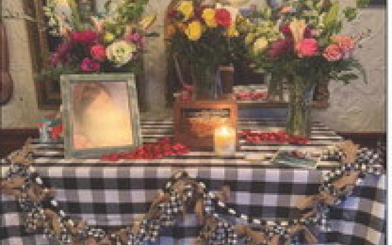 A memorial table was set in the restaurant on Blair Street for Liz Call’s memorial. Photo by Ginger Castle Hejl