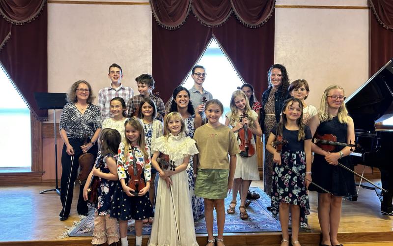 Photo credit Barbara Burtner Students of Lacey Black and Rebekah Soued-Weaver with their teachers at town hall recital.