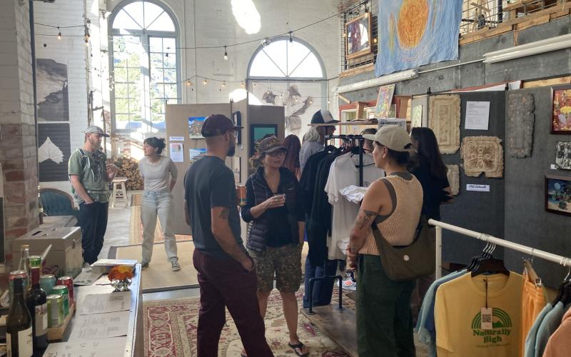 Folks enjoying the member art show August. Photo submitted by SPC