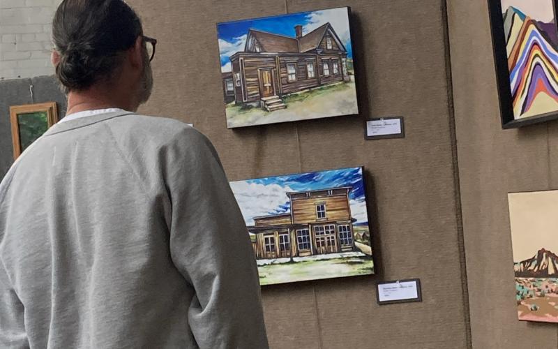 Member Art show in August, a Silverton resident admirers Abigail Armestead's work . Photo submitted by SPC