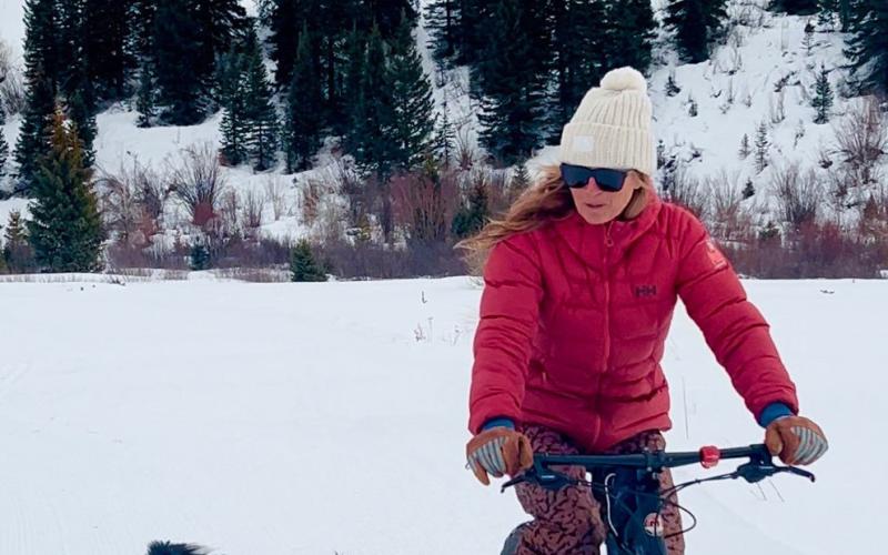 Kimmy Grant and her dog Oliver taking their daily fatbike ride on groomed trails. Photo credit DeAnne Gallegos