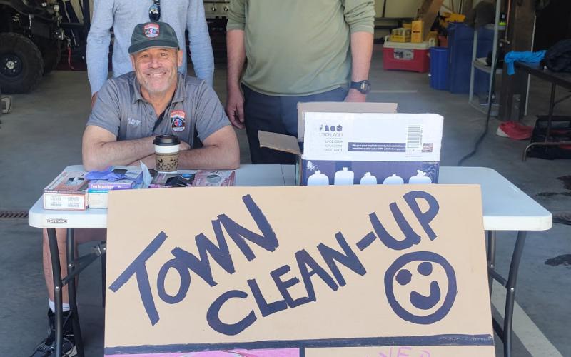 Silverton Medical Rescue’s Michael Burton poses with volunteers for the Town Clean up Day on Saturday. Photo credit Dayna Kranker