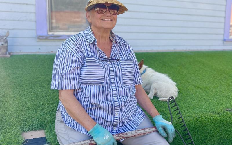 Longtime Silverton resident Betty Chavez takes a quick break from yard work to swap stories of decades past. Photo credit DeAnne Gallegos