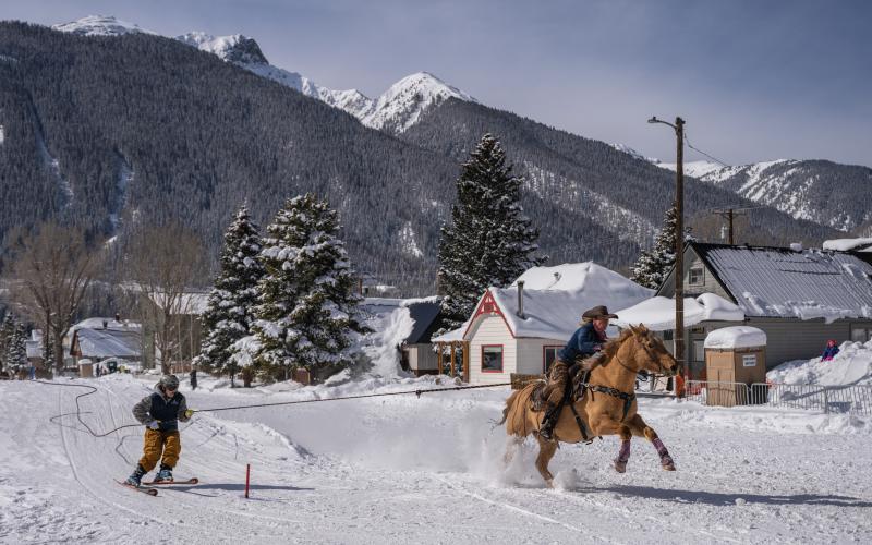 Skier and rider team racing down Blair Street on the sunny Sunday after the storm.. Photo credit Wesley Berg