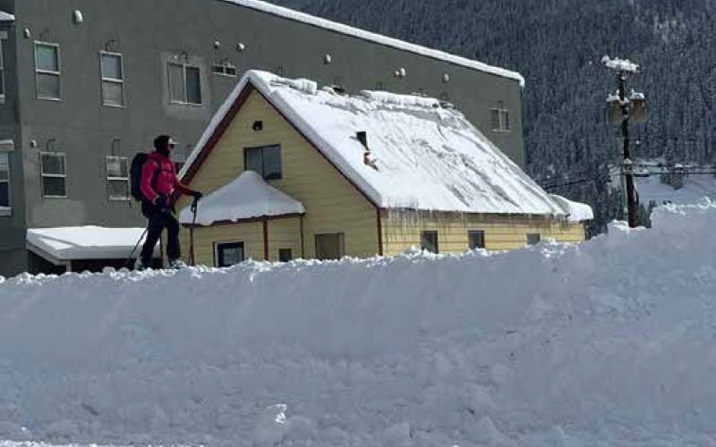 Skier enjoying the large snow pile on Greene Street. Photo by: Silverton Standard staff