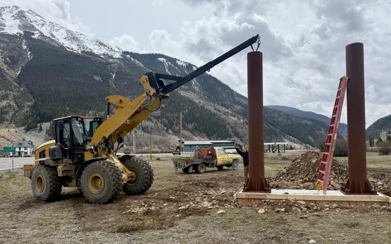 The Town of Silverton Public Works crew place and bolt down the new entryway sign poles on Monday photo by John Zarkis