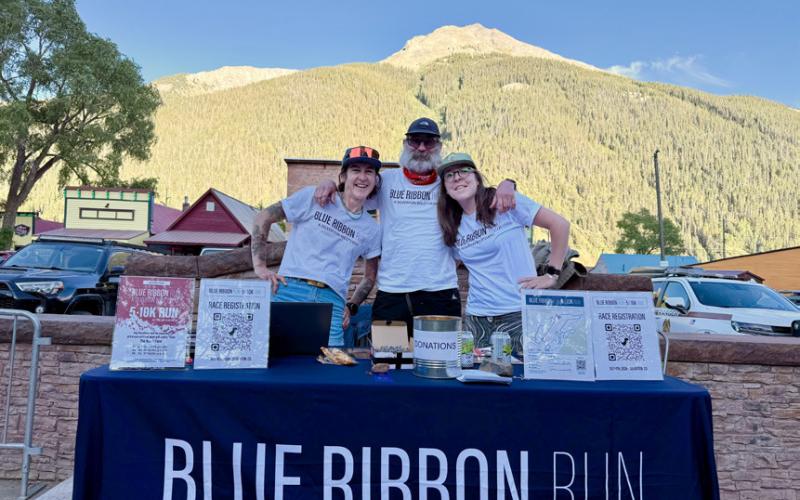 The Blue Ribbon Run sign up table with Yvonne, Angelo &amp; Delaney photo by DeAnne Gallegos