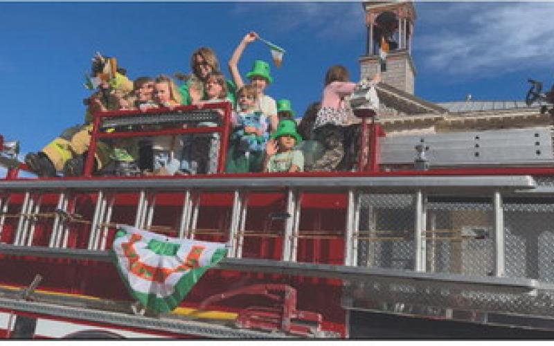 Silverton School kids rode on the fire trucks during the parade