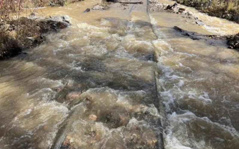 Large amounts of rushing water went over tracks during rain storms. Photo by DSNGRR