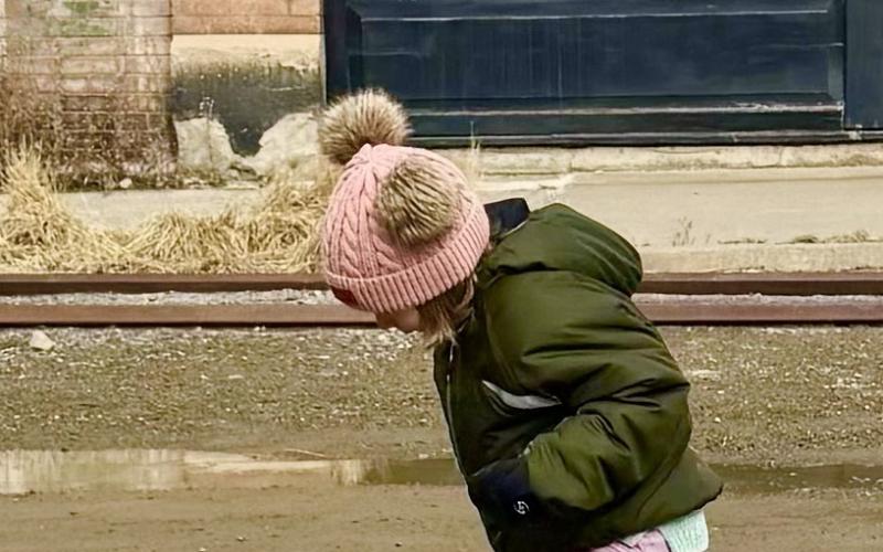 photo by Katey Fetch Instead of snow, the local kids found mud puddles to play in with the lack of snow on Christmas Eve