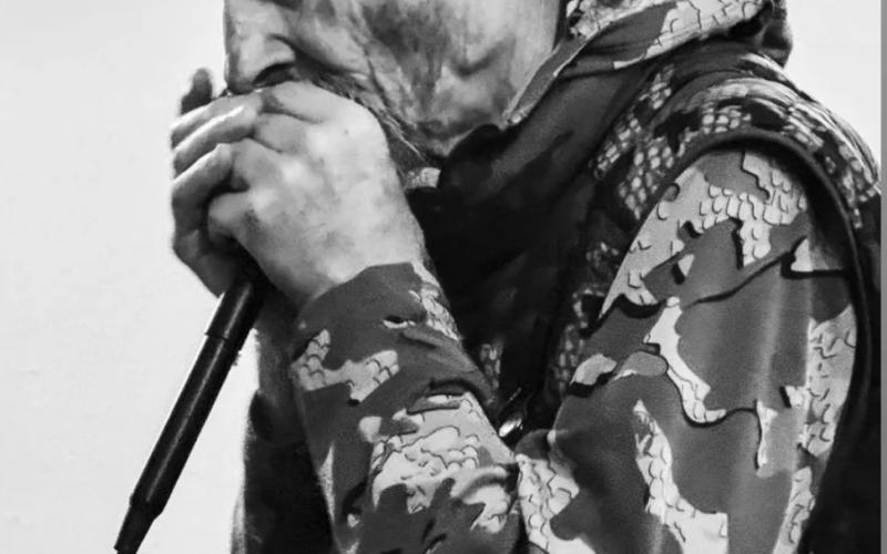 Photo by DeAnne Gallegos Fred Canfield (our weatherman) playing harmonica at the Dera Deli Winter Party