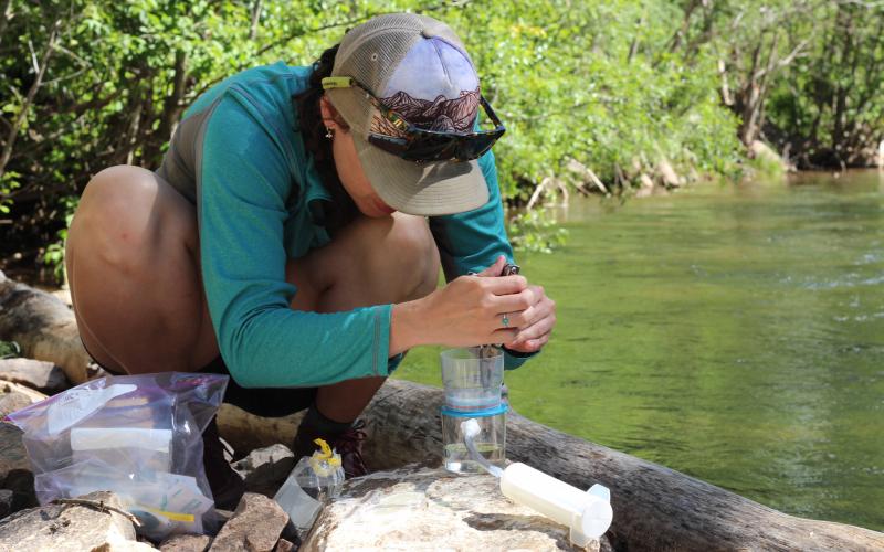 MSI staff performing water quality monitoring. Photo credit MSI