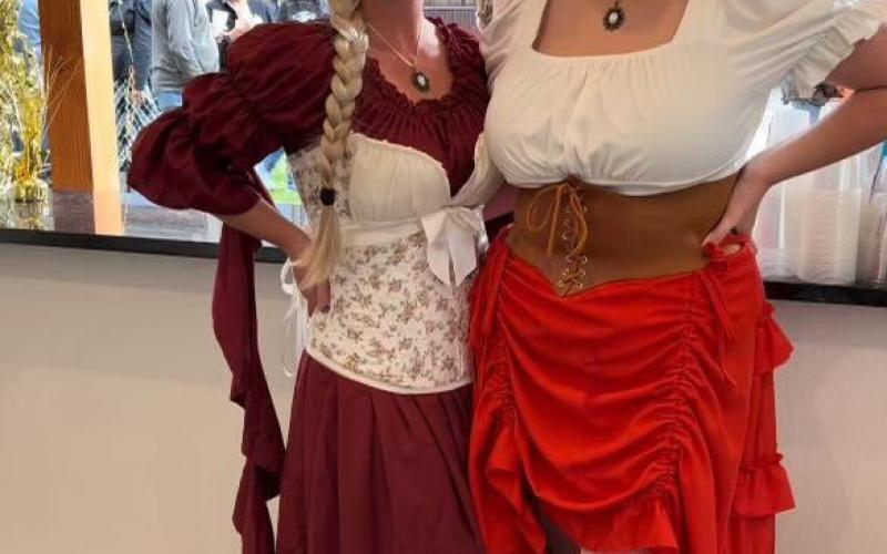 Melina Marks Lanis and Natalie Streeter bartend at the event in old tyme clothes.