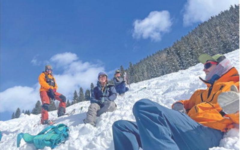 Resting after a successful practice rescue. From the right Cameron Crowell, Kelly Fetch, Erin Laine, and Kelly Weakley. Photo by Katey Fetch