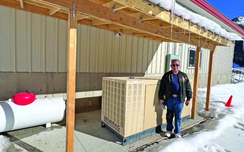 Chief Archuleta in front of the backup generator at the firehouse. Photo credit DeAnne Gallegos