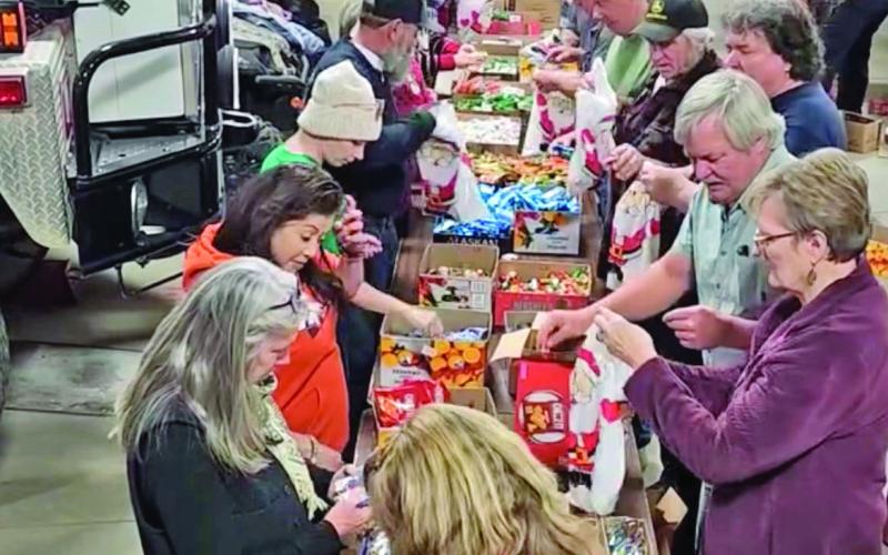 Volunteers at the annual fire department candy sacking event. Photo credit Jerry Chambers