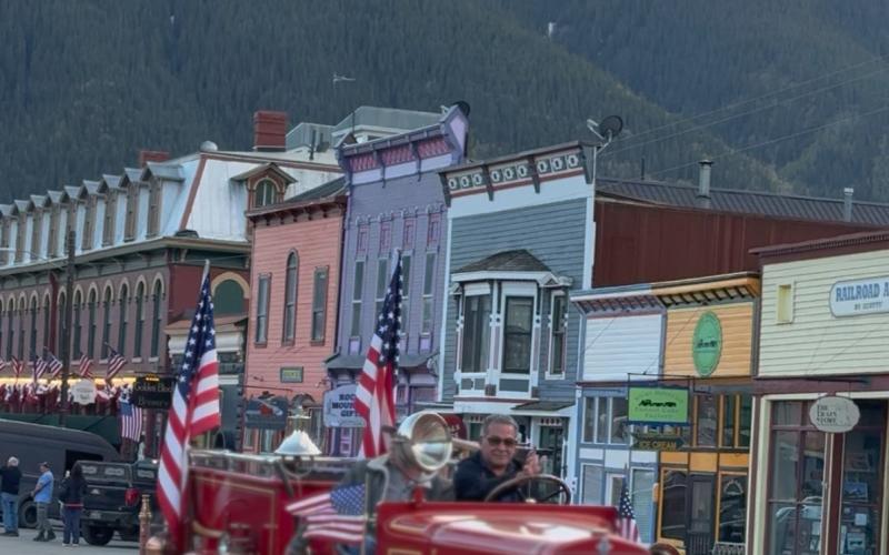 Fire Chief Gilbert Archuleta leads the graduation parade in the vintage fire truck photo by DeAnne Gallegos