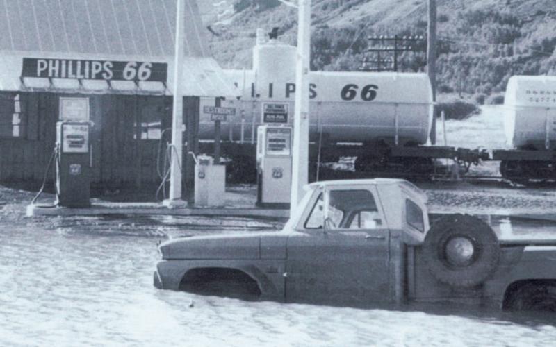 The Phillips 66 station at the wye is pictured during the flood of September1970. Standing on the back of the truck is Jim Melcher. San Juan County Historical Society photo