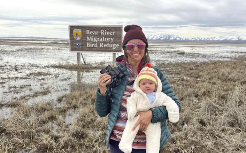 Whitney Gaskill and baby Iris at the location of the migrating tundra swans on the Great Salt Lake. Photo credit Whitney Gaskill
