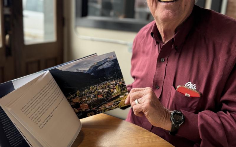 Author Bill Gardner showing the photography of the expedition featured in his book photo by DeAnne Gallegos