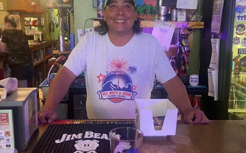 Marcos Chacon, a bartender at the Alpine Tavern smiles for the camera photo by Charla Bingel Andreatta
