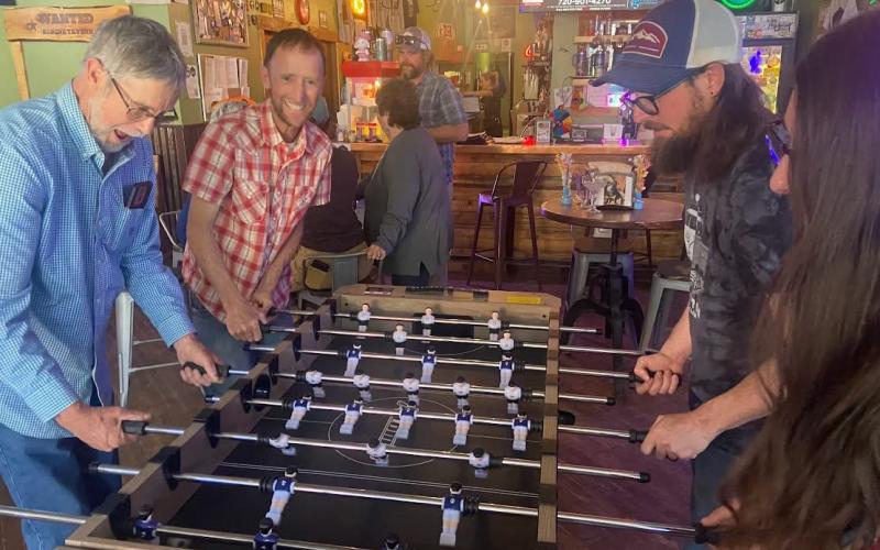 photo by Charla Bingel Andreatta Group there to enjoy the party play foosball at the Alpine Tavern