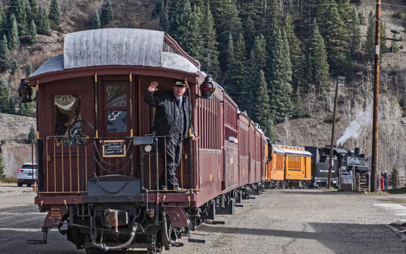 One last wave from the Train Conductor as the final train pulls out of Silverton Photo by Ray Dileo